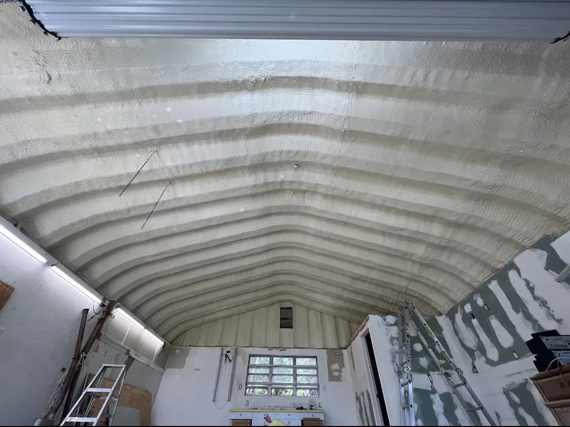 Spray polyurethane foam applied to the underside of a metal roof deck in Monroeville